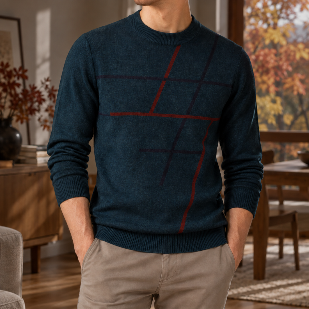 Pull homme bleu nuit orné de lignes rouges graphiques, bords-côtes aux poignets