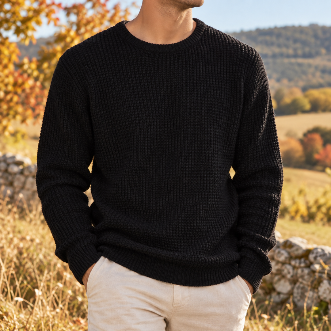 Pull homme noir en maille gaufrée avec poignets côtelés, vue de face