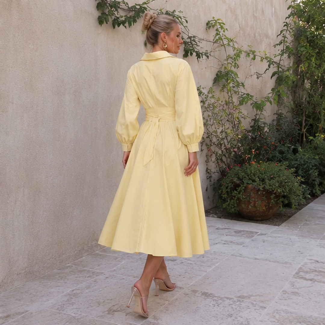 Vue de dos d'une robe chemise jaune midi avec jupe ample et nœud