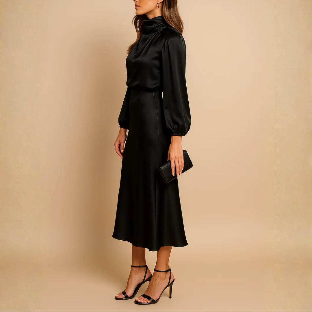Robe noire vue de dos, jupe midi évasée et fluide