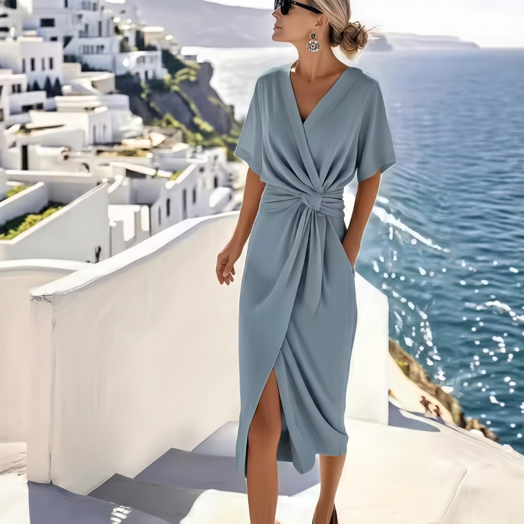 Robe midi bleue col V cache-cœur avec nœud twist à la taille, vue de face