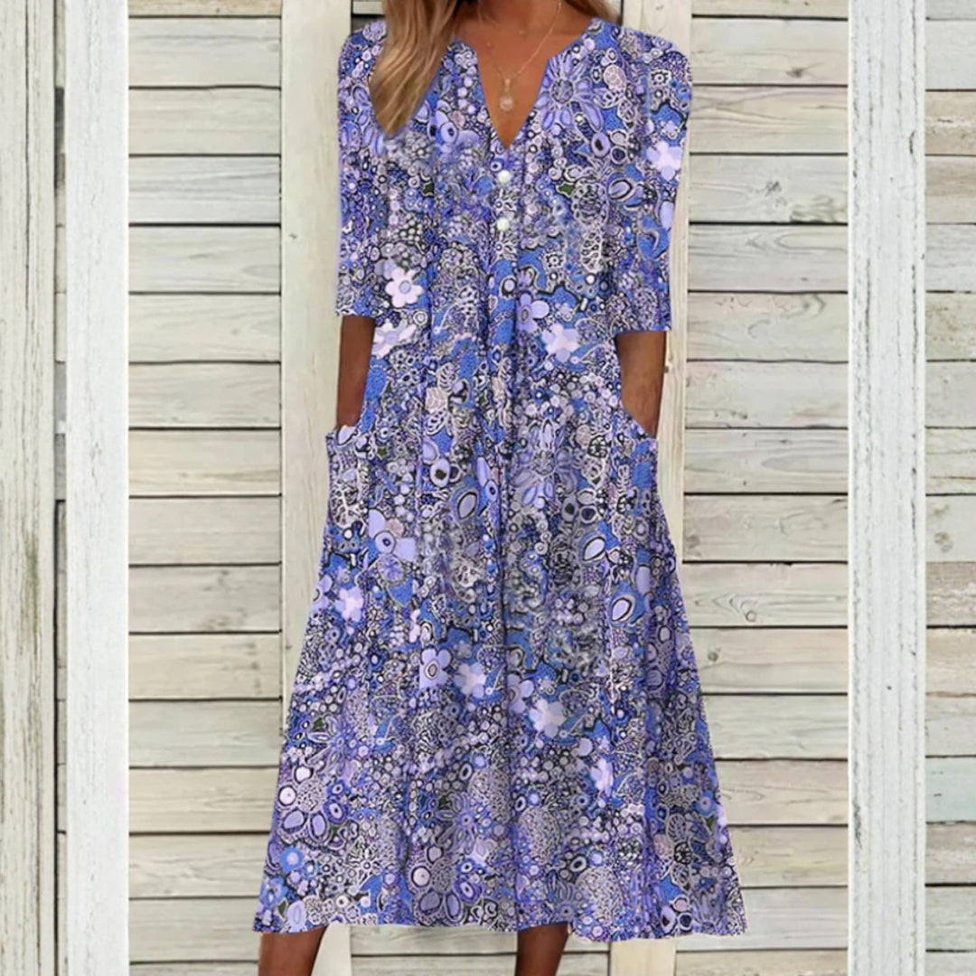Robe femme midi à fleurs coloris bleu coupe évasée vue de face