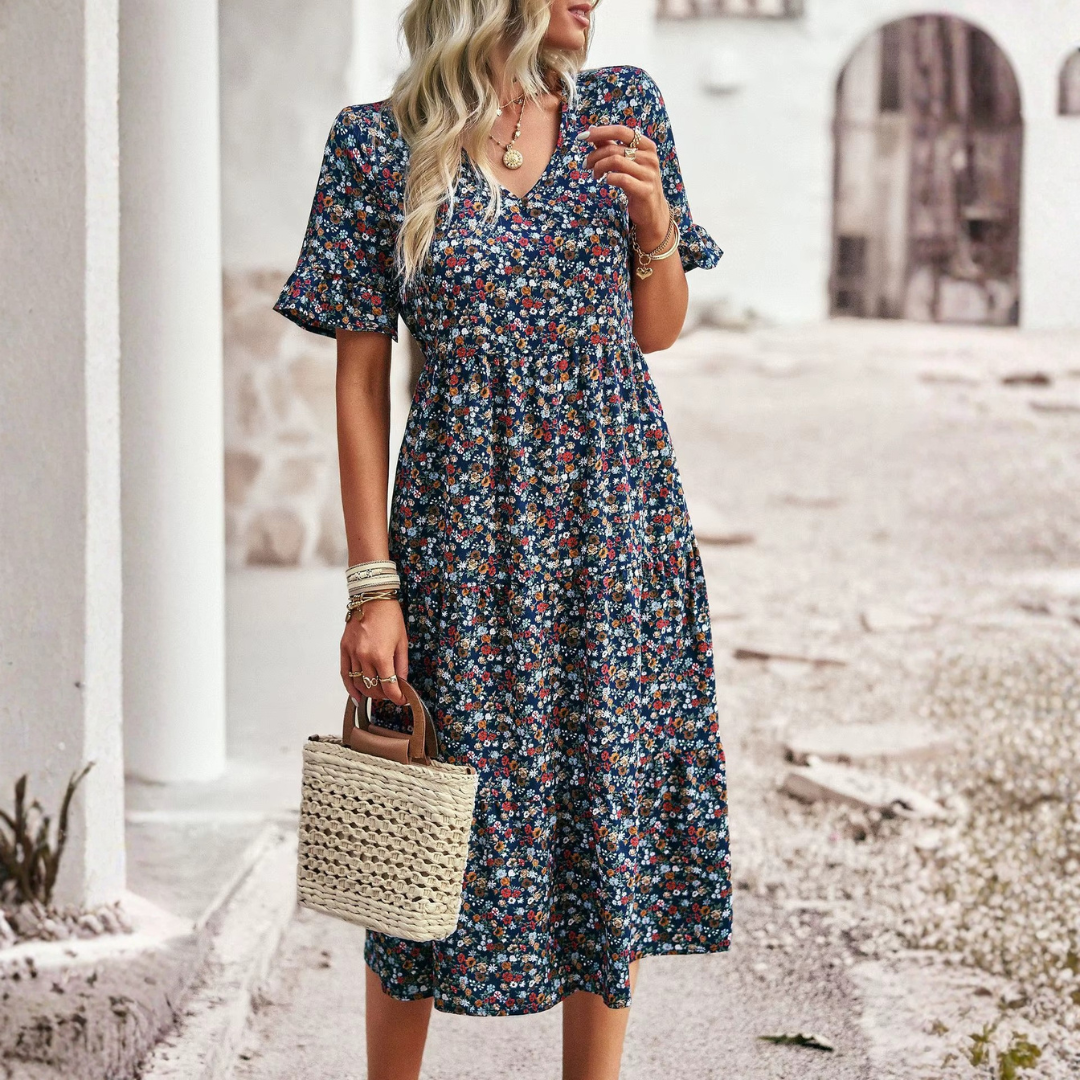 Robe bohème bleue à fleurs, vue de dos, coupe évasée mi-longue
