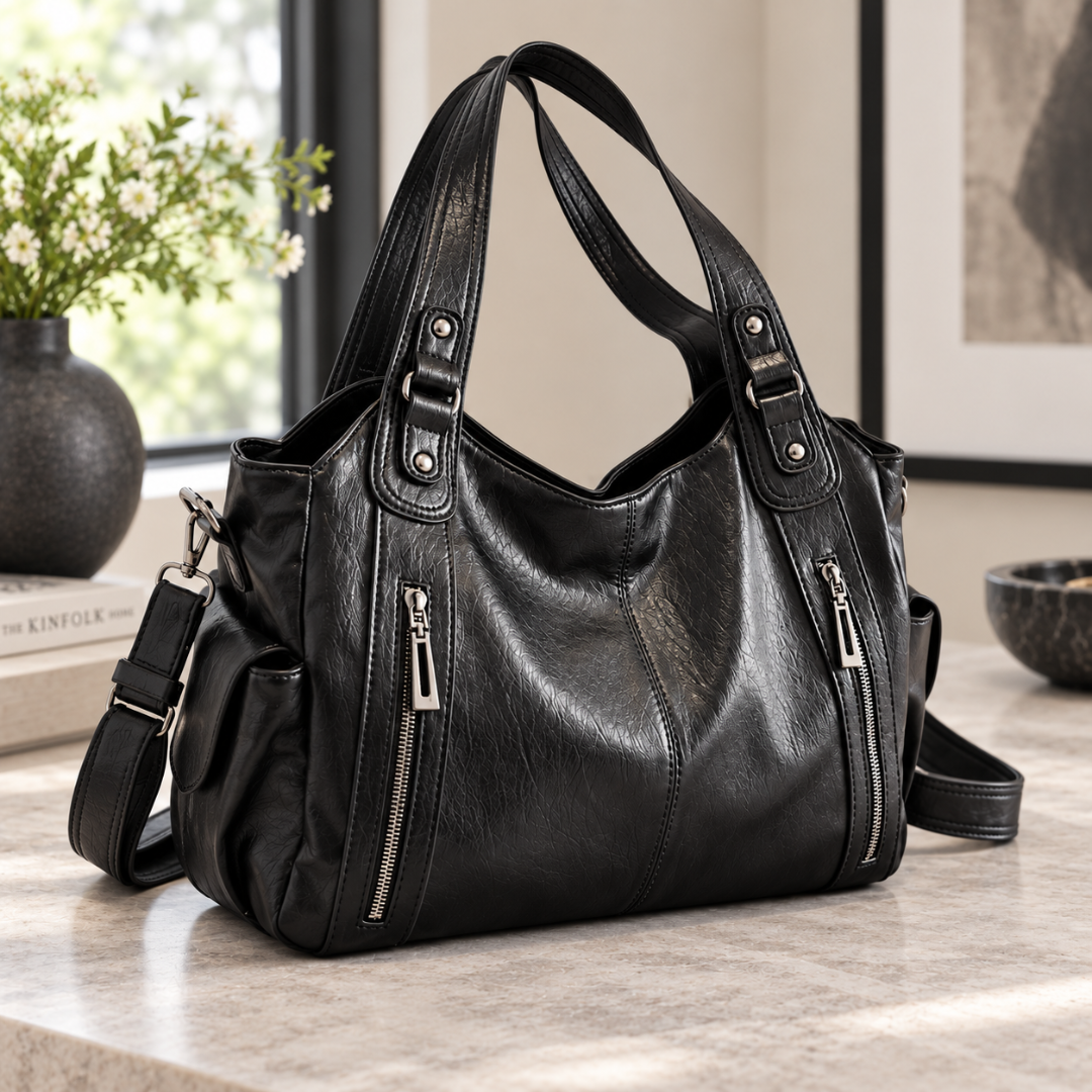 Sac femme noir porté épaule avec double anse et bandoulière amovible