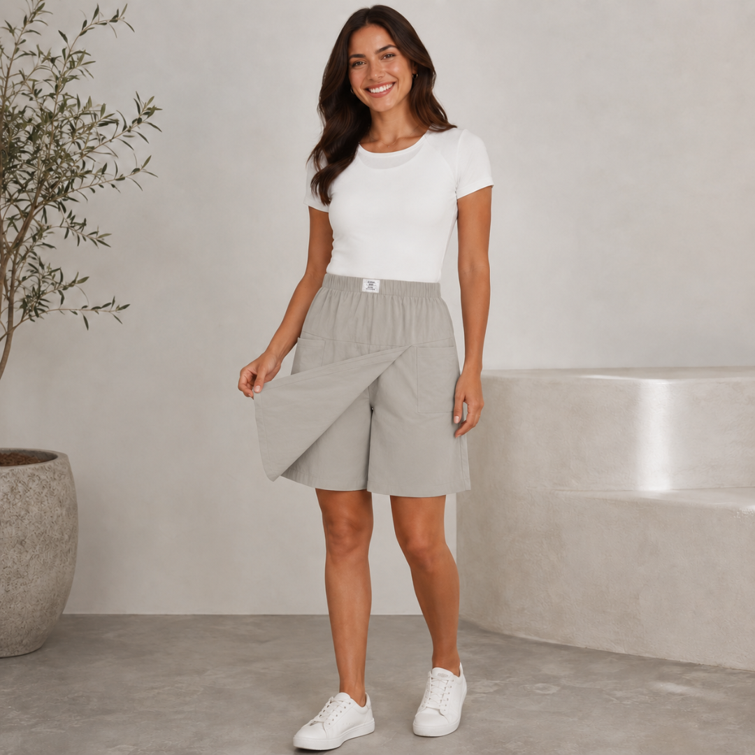 Femme portant un short bermuda gris clair avec t-shirt blanc, vue de face