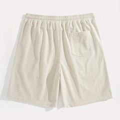 Vue arrière du short homme beige avec poche plaquée et taille élastique