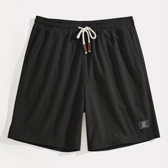 Short homme noir à plat avec cordon blanc et motif texturé fin