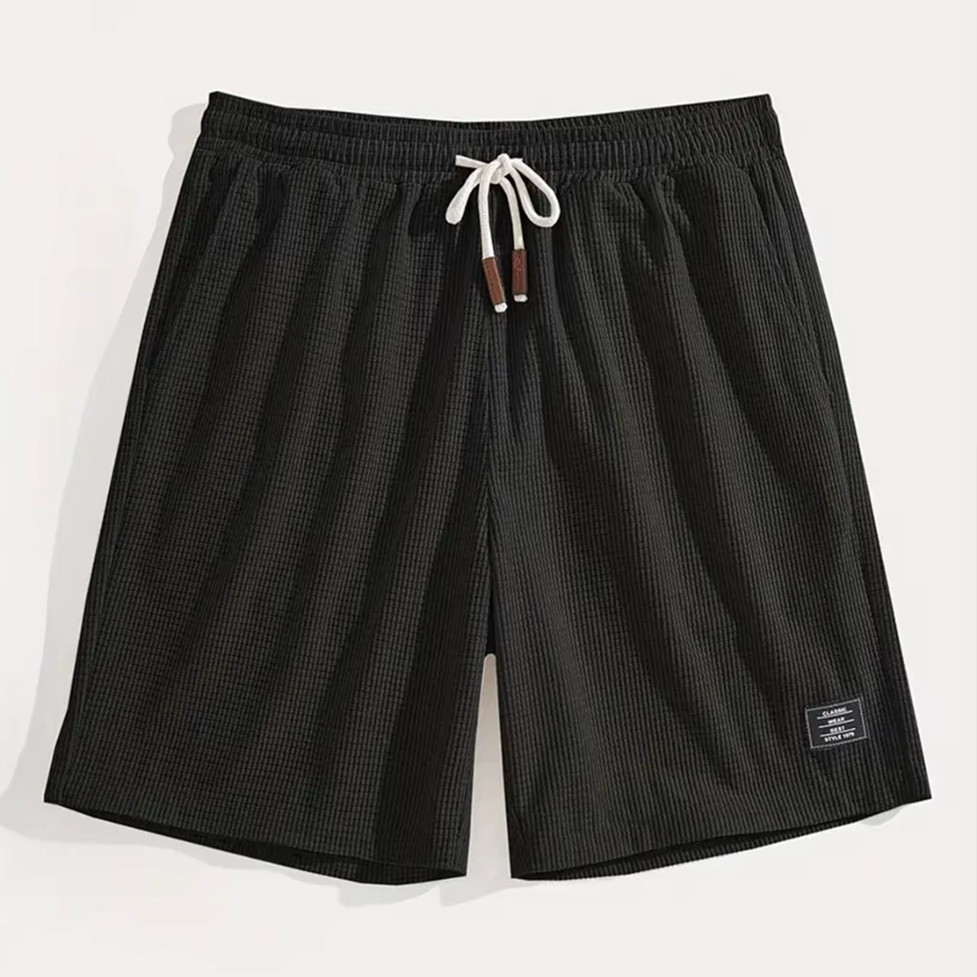 Short homme noir à plat avec cordon blanc et motif texturé fin