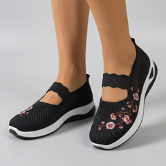 Sneakers femme slip-on noir broderie florale semelle blanche vue de côté