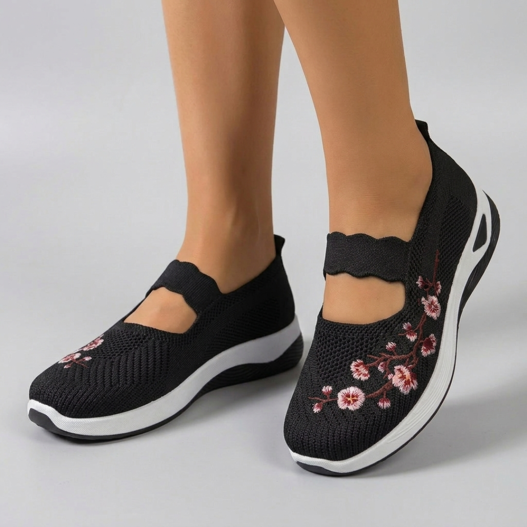 Sneakers femme slip-on noir broderie florale semelle blanche vue de côté