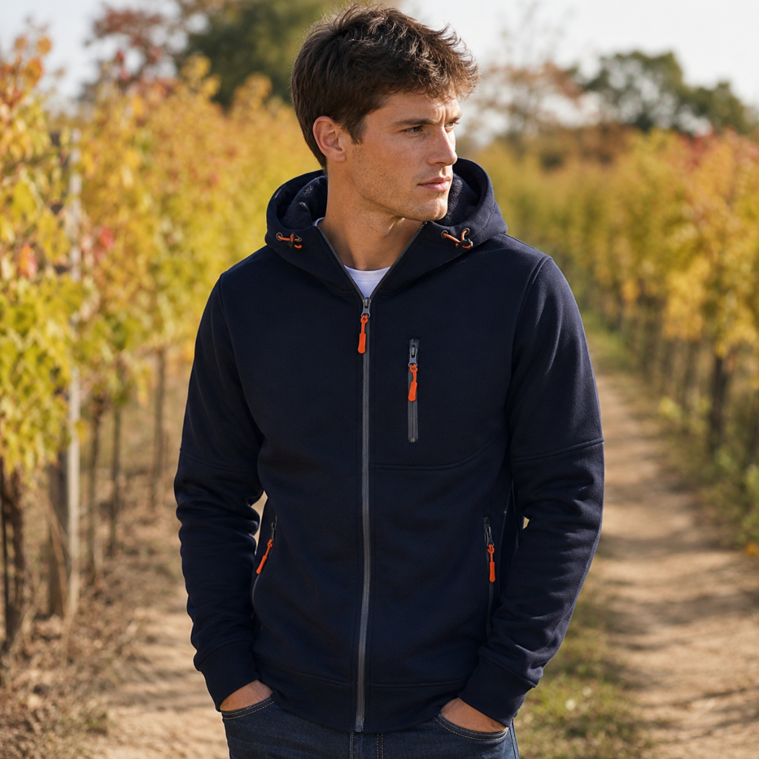 Sweat homme bleu marine zippé avec capuche, poche poitrine zippée et bas côtelé
