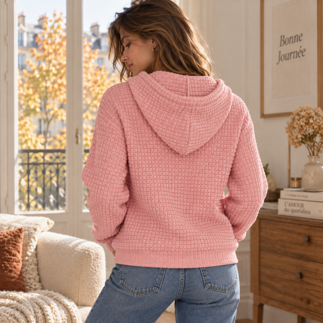 Dos du sweat à capuche rose montrant l'effet gaufré et la bande côtelée