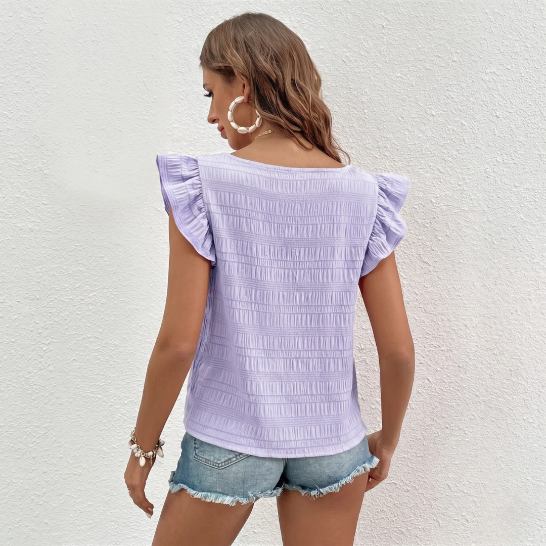 Top Rosalie violet lilas porté avec short en jean, vue de dos