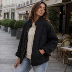 Veste matelassée noire à poches latérales et fermeture zippée dorée