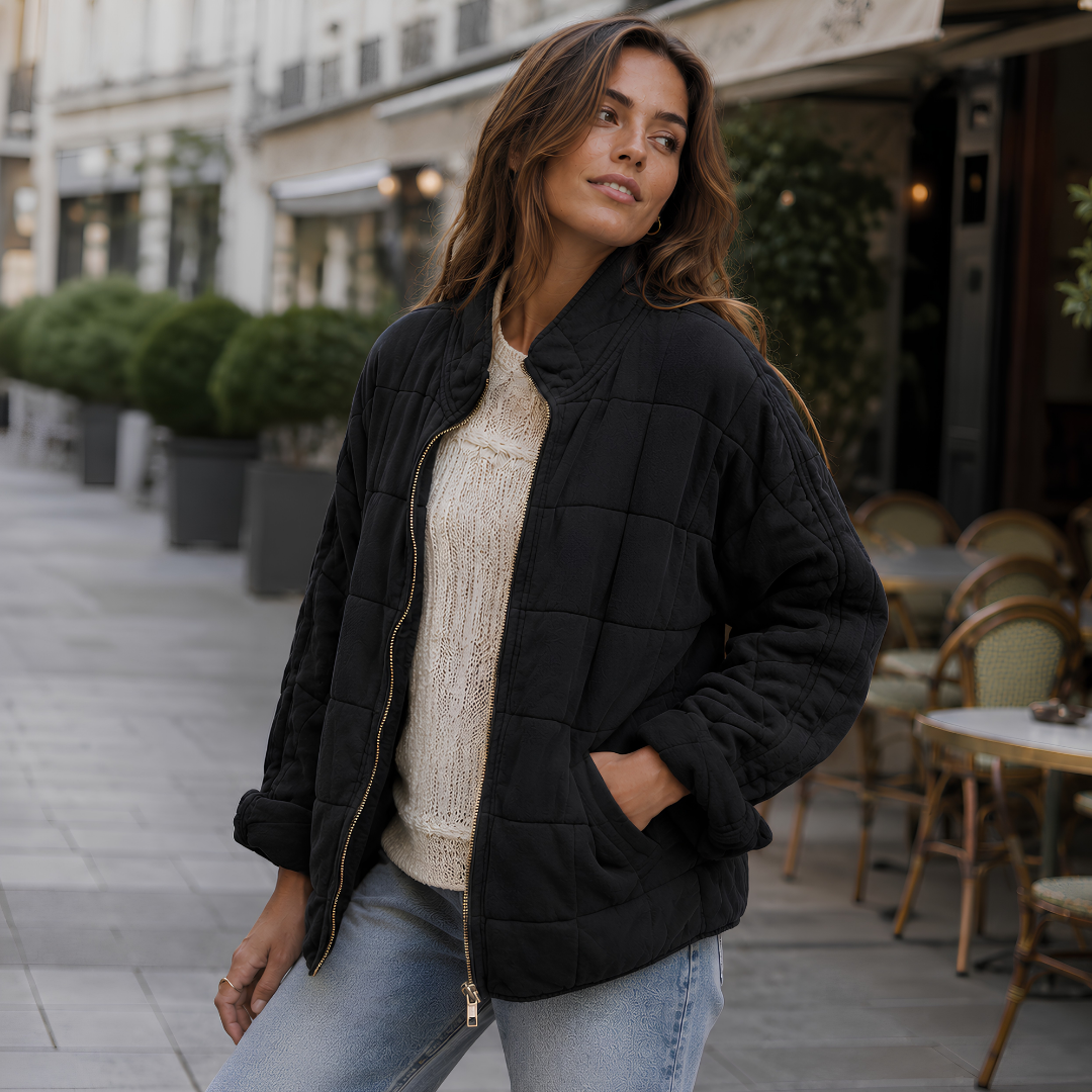 Veste matelassée noire à poches latérales et fermeture zippée dorée