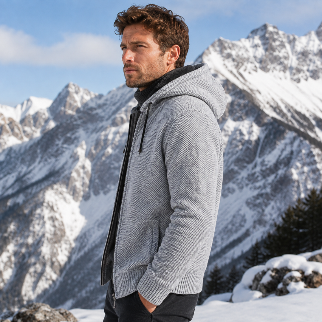 Vue de profil de la veste gris clair, capuche à cordon et manches côtelées